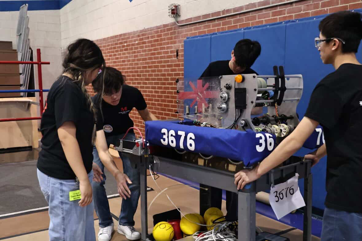 Redshift Robotics working on robot 3676 in the pit